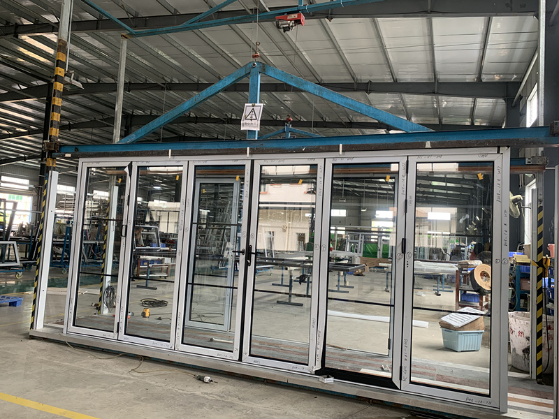 Pre-assemblying and testing bifolding door in our factory